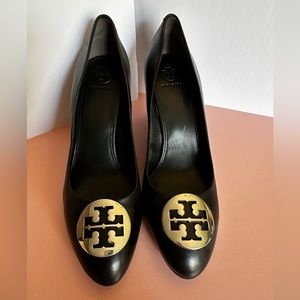 Tory Burch wedge shoes with silver logo.